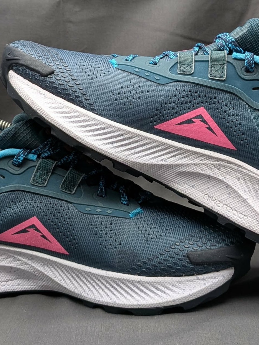 Nike Women's Teal Running Shoes with Pink Accents